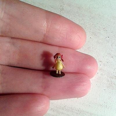 Tiny doll in the yellow dress