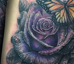 Grayscale to Color Shifting Rose and Butterfly Arm Tattoo